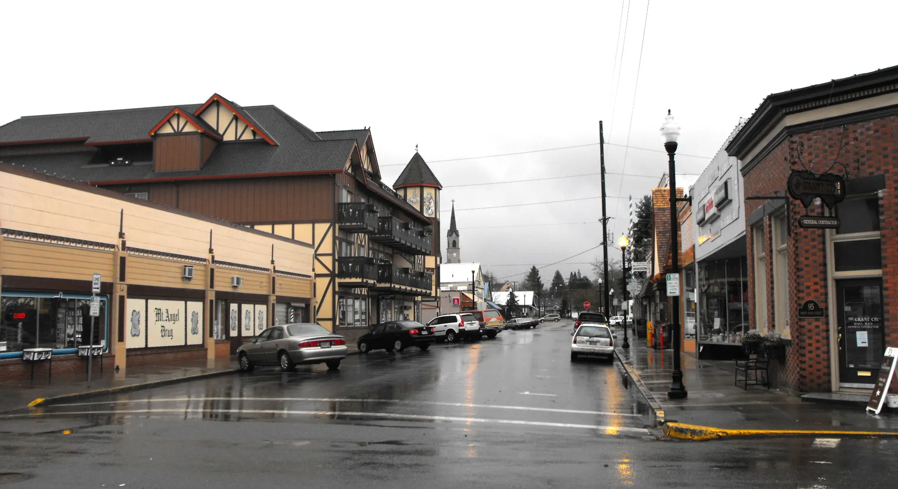Bavarian-styled storefronts along Charles Street in downtown Mount Angel, Oregon, after rain